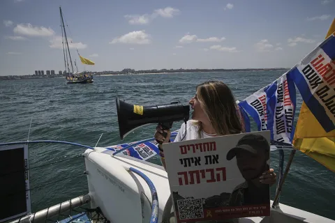 Relatives and supporters of Israeli hostages held by Hamas sail along the coast of Israeli southern city of Ashkelon towards the Gaza Strip, in a protest demanding their release from captivity and calling for an end to the war
