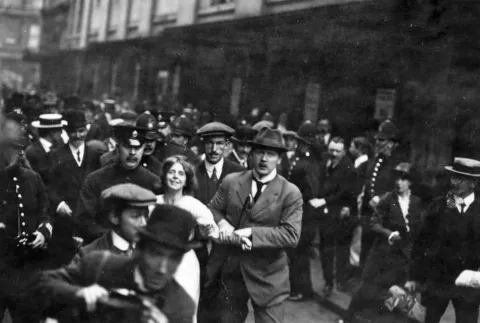 Unknown photographer, Annie Kenney (an Oldham cotton mill worker) arrested in London, April 1913 [Pic: © Alamy]