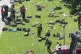 EXHAUSTED: Firefighters break from attending the burning tow