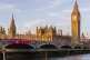 XR activists drop a banner from London’s Westminster Bridg