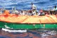 Migrants on board a barely seaworthy vessel
