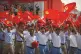 LONG-LASTING: Revellers wave CPC flags during a parade comme
