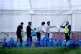 A group of people thought to be migrants gather their belong