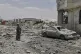 A Yemeni soldier inspects the damage reportedly caused by US air strikes in Sanaa, Yemen, April 27, 2025