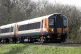 A South Western Railway train making it's way along the line near to Basingstoke in Hampshire