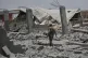 A Yemeni soldier inspects the damage reportedly caused by U.S. airstrikes in Sanaa, Yemen, April 27, 2025