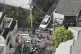 Police officers inspect a vehicle believed to have hit elementary school stud,ents May 1, 2025 in Osaka, western Japan. Photo: Kyodo News via AP 
