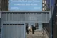 A student and a teacher carry study material at UNRWA Girls School run by the UN agency for Palestinian refugees in the Shuafat Refugee Camp in east Jerusalem, May 8, 2025