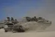 Israeli troops move with APC, armored personnel carrier, near the border with Gaza, in southern Israel, May 8, 2025