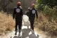 First responders carry a body at the site of a mass grave in Raqqa, Syria, the city that served as the de facto capital of the Islamic State group, Sept. 7, 2019