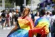 People wrapped in rainbow flags take part in the LGBTQ+ Pride parade in Rome, Saturday, June 10, 2023