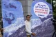 A protestor demands climate justice in front of the Higher Regional Court in Hamm, Germany, ahead of the verdict in the climate lawsuit brought by Peruvian farmer Luciano Lliuya against German energy company RWE, May 28, 2025
