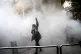 A university student attends a protest inside Tehran University after a smoke grenade was thrown by anti-riot police, in Tehran, Iran, December 30, 2017