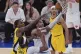 New York Knicks guard Jalen Brunson (11) goes up for a shot against Indiana Pacers forward Aaron Nesmith (23) and Indiana Pacers center Myles Turner (33) during the third quarter of Game 5 of the NBA basketball Eastern Conference final, May 29, 2025