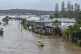 Rescue personnel patrol in flooded waters at homes in Port Macquarie, north of Sydney, Australia, May 22, 2025. Photo: Lindsay Moller/AAP Image via AP