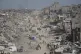 Displaced Palestinians fleeing Beit Lahia amid ongoing Israeli military operations in the Gaza Strip arrive in Jabalia, northern Gaza, May 16, 2025