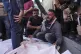 Osama Abu Mosabbah, mourns his wife and two children who were killed in an Israeli army airstrike on the Gaza Strip, during their funeral at Al-Aqsa Hospital in Deir al-Balah, Gaza, May 20, 2025
