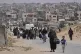 Displaced Palestinians flee from Khan Younis, Gaza, amid the ongoing Israeli military offensive in the area, May 19, 2025