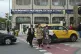 People cross a street with a news ticker in the background reporting on a phone call between Russian President Vladimir Putin and U.S. President Donald Trump, on the facade of the TASS news agency building in Moscow, Russia, May 19, 2025