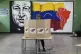 A voter marks her ballot and candidate in legislative and local elections in Caracas, Venezuela, May 25, 2025