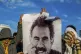 Youngsters hold a photograph of the jailed leader of the rebel Kurdistan Workers' Party, or PKK, Abdullah Ocalan, in Diyarbakir, Turkey, February 27, 2025