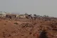 People gathered in a flooded area after heavy rainfall in the market town of Mokwa, north-central Nigeria, May 31, 2025
