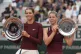 First-placed Austria's Lilli Tagger, left, and second-placed Great Britain's Hannah Klugman hold trophies after the girls' singles final match of the French Tennis Open at the Roland-Garros in Paris, Saturday, June 7, 2025