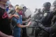 Protesters confront police on the 101 Freeway near the Metropolitan Detention Centre in downtown Los Angeles, June 8, 2025, following last night's immigration raid protest