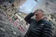 A resident reacts after a Russian missile hit a multi-storey apartment during Russia's combined missile and drone air attack in Kyiv, Ukraine, June 17, 2025