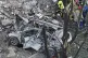 Firefighters work on the site of a damaged building after a Russian attack in Kyiv, Ukraine, June 23, 2025