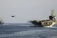 The US aircraft carrier USS Dwight D Eisenhower and other US warships cross the Strait of Hormuz into the Persian Gulf, November 26, 2023