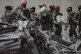Israeli soldiers from the Home Front Command unit work at the site struck by an Iranian missile strike that killed several people, in Beersheba, Israel, June 24, 2025