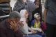 Hamam Al-Farani sits next to his sister (in white), along with other family members as the body of their father Alaa, killed by an Israeli army strike that also injured the boy, is prepared for burial at Shifa hospital in Gaza City, June 24, 2025