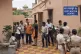 Police personnel and relatives of victims who lost their lives in a crowd surge at a Hindu religious procession wait outside a postmortem center at a government hospital in Puri, India, June 29, 2025