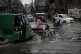 Motorists drive through a flooded road caused by heavy monsoon rains, in Lahore, Pakistan, June 29, 2025