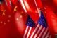 US flags are displayed together with Chinese flags on top of a trishaw on September 16, 2018, in Beijing