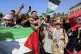 Members of a humanitarian convoy of at least 1,500 people, including activists and supporters from Algeria and Tunisia, shout pro-Palestinian slogans as they gather, on their way to Gaza via Egypt's Rafah Crossing, in Zawiya, Libya, June 10, 2025