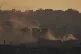 Buildings that were destroyed during the Israeli ground and air operations stand in northern of Gaza Strip during the sunset as seen from southern Israel, June 3, 2025