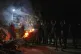 Palestinians line up to buy dinner at a food stand near the beachfront at a tent camp for displaced people in the Gaza City port, June 14, 2025