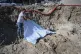 Supervising engineer Haris Charismiadis stands next to human remains believed to belong to prisoners executed during or after Greece's 1946-49 Civil War in Thessaloniki, northern Greece, June 7, 2025