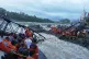 Rescuers work at the site of a bridge collapse near Pune, India, June 15, 2025