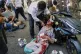  An injured man is assisted in the street after an explosion in downtown Tehran, amid Israel's three-day campaign of strikes against Iran, June 15, 2025