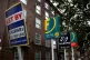 Letting and estate agents signs outside flats on the Old Kent Road in London