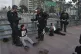 California Highway Patrol officers arrest two men after a dispersal order during a protest, June 14, 2025, in Los Angeles