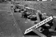 A twisted sign, felled concrete posts and a broken wall tell the story of violence outside a coking plant in Orgreave, South Yorkshire, June 18, 1984