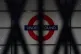 A sign for the London Underground seen through the closed shutters at Euston station, central London