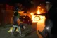 A police car burns as officers are deployed on the streets of Hartlepool following a violent protest, July 31, 2024