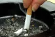A smoker stubbing out a cigarette