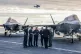 Prime Minister Keir Starmer (third left) and Defence Secretary John Healy (third right) talk with naval officers on the flight deck of HMS Prince of Wales, the Royal Navy's flagship aircraft carrier, in Plymouth, Devon, April 24, 2025