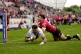 St Helens' Kyle Feldt (left) scores their side's second try of the game under pressure from Salford Red Devils' Shane Wright during the Betfred Super League match at Salford Community Stadium, June 15, 2025